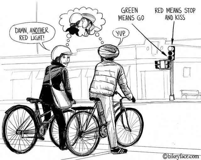 Ciclistas en un semáforo, ligar es básico